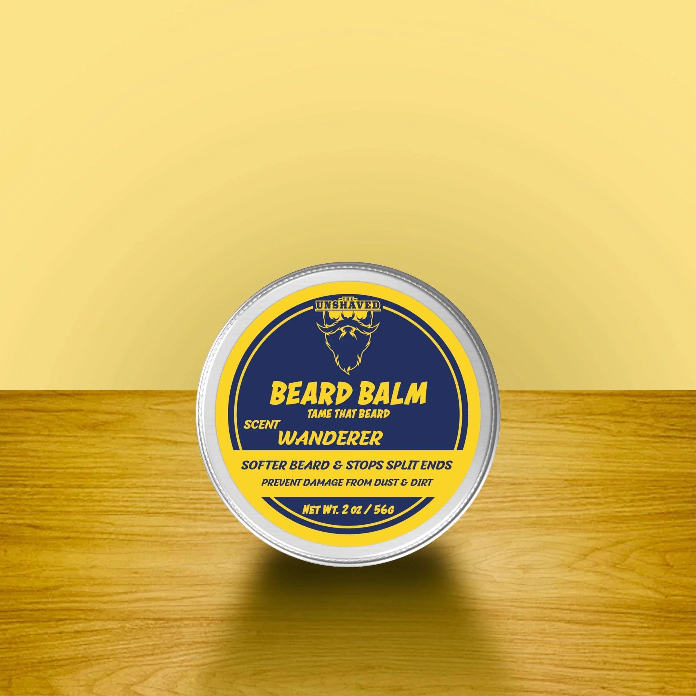 Beard balm tin labeled Wanderer scent on wooden surface, natural beard care product